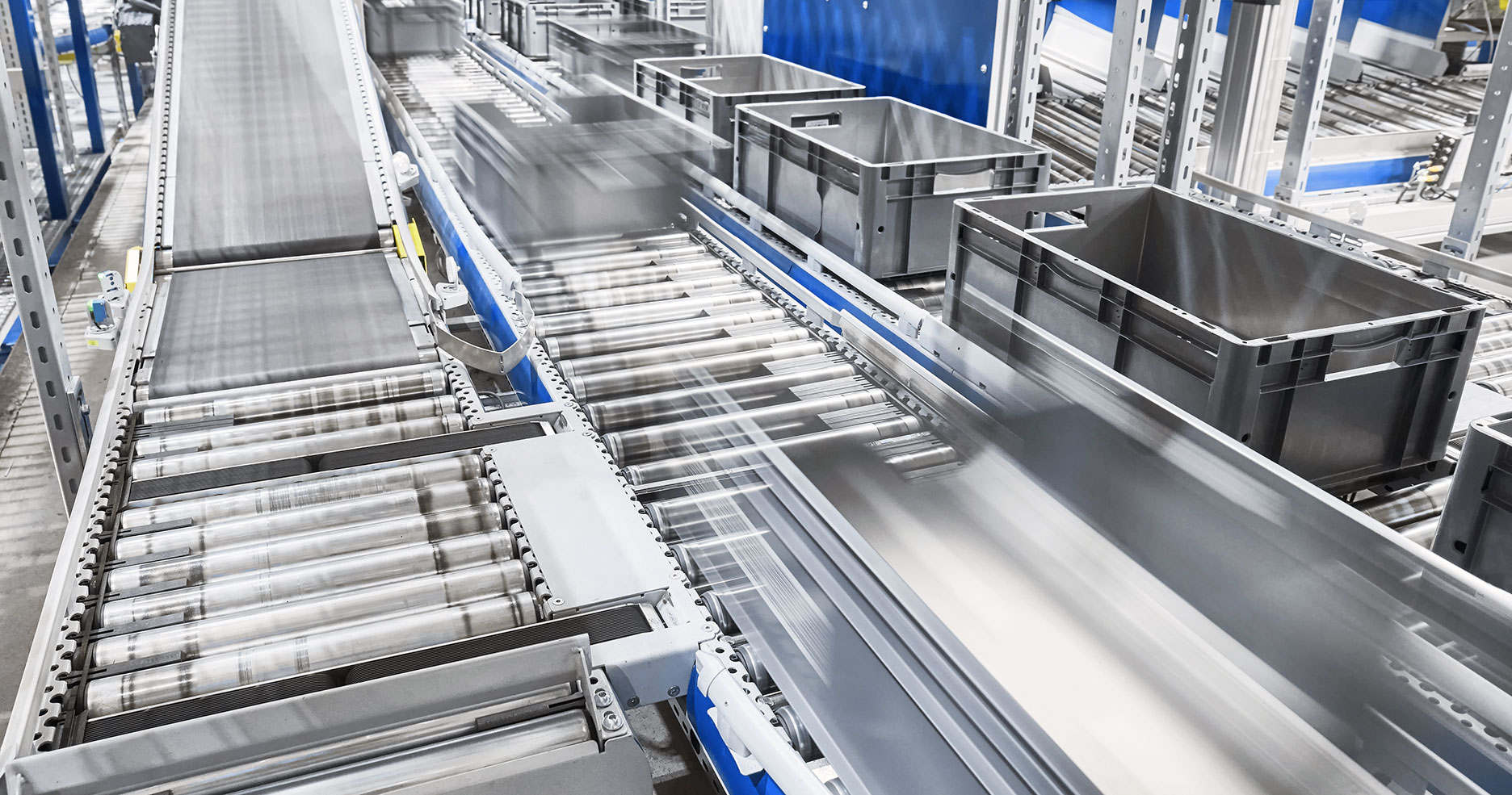 modern-conveyor-system-with-boxes-in-motion-2021-08-27-10-14-48-utc_sm
